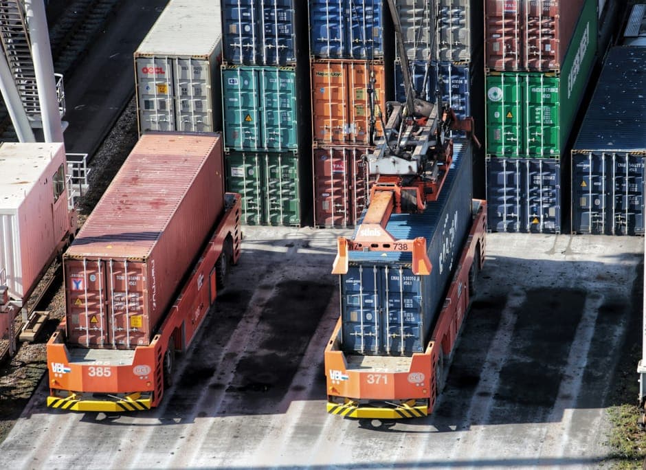 Container carriers loaded with shipping containers at a port terminal
