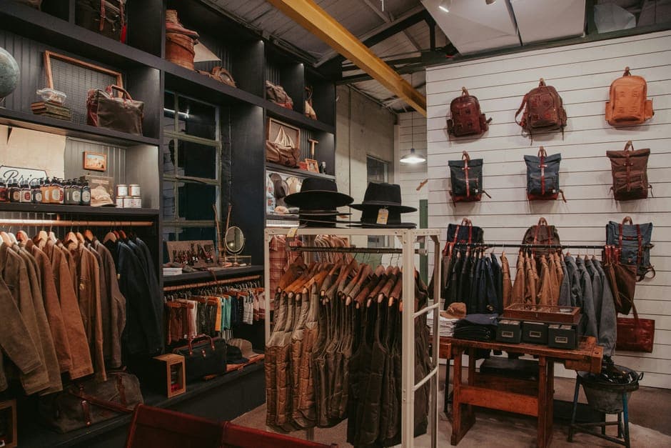 A shop wall of leather bags, jackets and hats